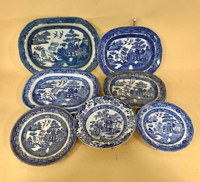six blue and white plates with animals and trees on them