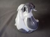 a figurine of a dog sitting on a table