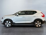 a white volvo suv parked in a garage