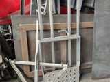 a metal ladder leaning against a wall in a garage