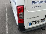 a white van that is parked in a parking lot