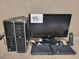 un ordinateur de bureau équipé d'un clavier, d'une souris et d'un écran