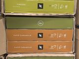 several boxes of coffee are stacked on top of each other