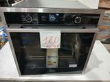 an image of a stainless steel oven with a price tag on it