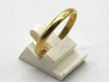 a gold ring sitting on top of a white block