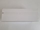 an empty piece of white paper on a white surface with a small hole in the middle of it
