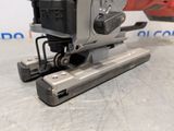 an image of a close up of a cordless stapler on a table