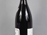 a bottle of wine that is sitting on a table