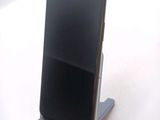 a cell phone that is sitting on a stand