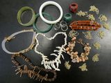 many different types of jewelry on the table