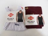 two pairs of men ' s tank tops and shorts are shown on a table