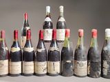 several bottles of wine are lined up in a row on a table