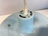 a blue light that is on top of a white table