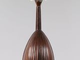 a close up of a mandolin hanging from a string