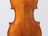 an antique violin with a wooden back and bow on a white background