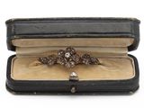 a ring in a case that is sitting on a table