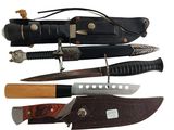 several different types of knives are lined up on a white surface