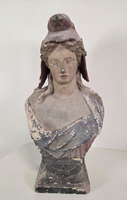 a statue of a woman with a hat on her head