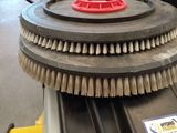 a close up of a brush on top of a machine