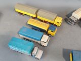a lot of toy trucks that are sitting on a table