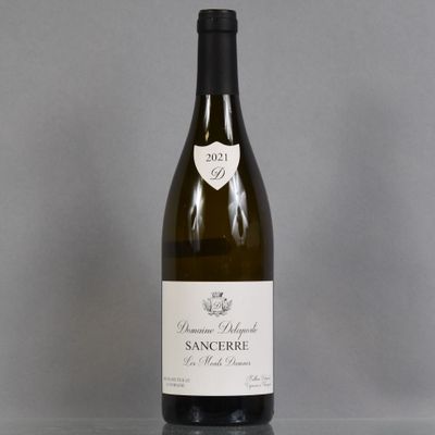 a bottle of wine that is sitting on a table