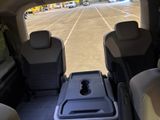 a view from the back seat of a van of a parking lot