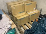 a pile of boxes sitting on a pallet in a warehouse