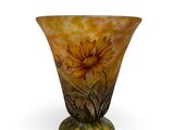 an image of a vase with a yellow flower on it