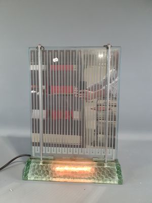 a bird in a cage sitting on a table