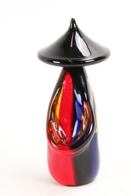 a glass vase with a black top and a red base