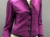 the mannequin is wearing a purple jacket and beige pants