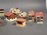 a lot of small model houses that are on a table
