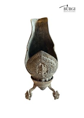 a vase that is sitting on a stand on a white background