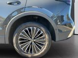 a close up of a car ' s wheel on the ground