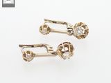 pair of gold tone earrings with clear crystal stones on white background