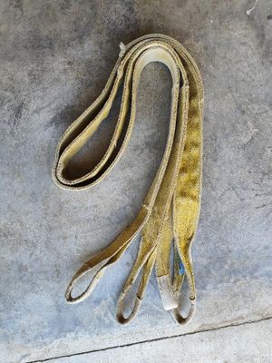 a brown leash that is laying on the ground