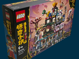 a box of legos with a building inside of it