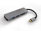 the usb hub is connected to a type - c adapter on a white surface