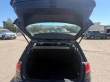 the back end of a car with its trunk open in a parking lot