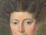 portrait of a woman with curly hair, wearing a white shirt