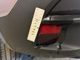 a sticker on the back of a car that has a sticker attached to it