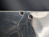 a close up of a metal object with a hole in it