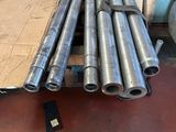 a lot of pipes sitting on the floor in a room