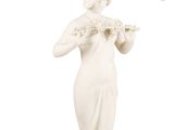 statue of a woman holding a tray with flowers in her hands
