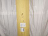 a large yellow bag sitting on top of a white table