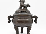 an image of a bronze incense bowl with a dog on top