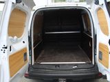 a white van with a wooden paneled door open