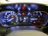 the dashboard of a car with a speedometer, gauges, and other electronic equipment