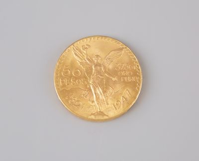 a gold coin with a picture of an angel on it