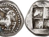 a silver coin with an image of a horse on it